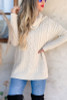 Ivory sweater braided detail design very flattering side slits at the hips, high neck or fold down. Super soft, longer sweater sits below the hips and longer sleeves for that ultra coziness.