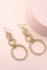 vintage-style earrings, featuring linear triple circle drop earrings filled with rhinestones.