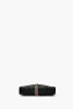 Black quilted crossbody envelope shape gold hardware front tassel detail.