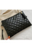 Black quilted tassel clutch bag purse