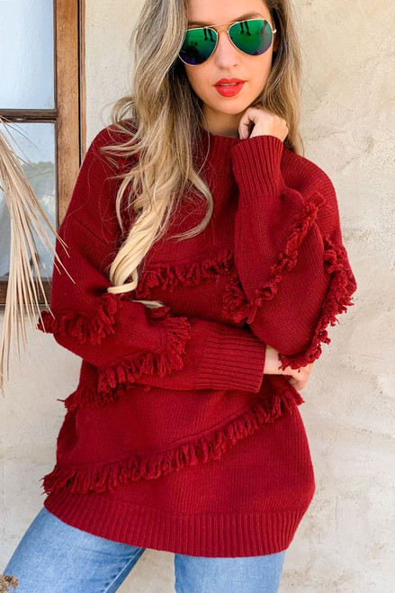 Burgandy sweater, diagnal fringe detail design.