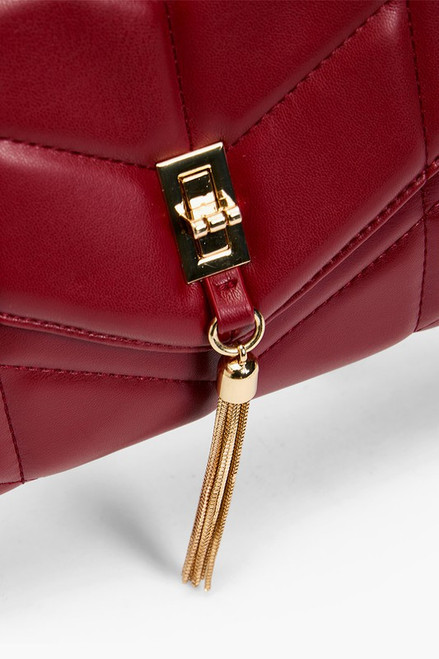 Red quilted crossbody envelope shape gold hardware front tassel detail