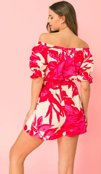 Pink and red printed romper off the shoulder. Bright vivid colors, elastic waist with a waist tie.