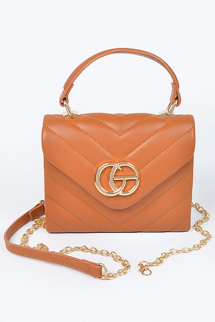 Camel quilted CG top handle bag 6.75 wide by 4.75 high by three deep polyurethane, mixed metal