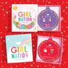 Girl Nation Christmas earrings displayed in colorful holiday jewelry gift boxes