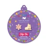 Snowflake and Ice Skate Mix & Match Clip-On Earrings displayed on purple Girl Nation Christmas ornament card