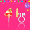 Girl Nation hot cocoa mug clip-on earring showing hand-painted enamel, candy cane details and soft transparent silicone clip on festive pink background
