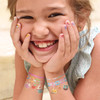 Girl wearing Girl Nation Cutie Pop temporary tattoo jewelry
