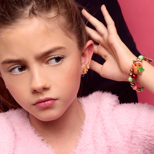 Girl wearing Girl Nation Jingle Bell Christmas charm bracelet