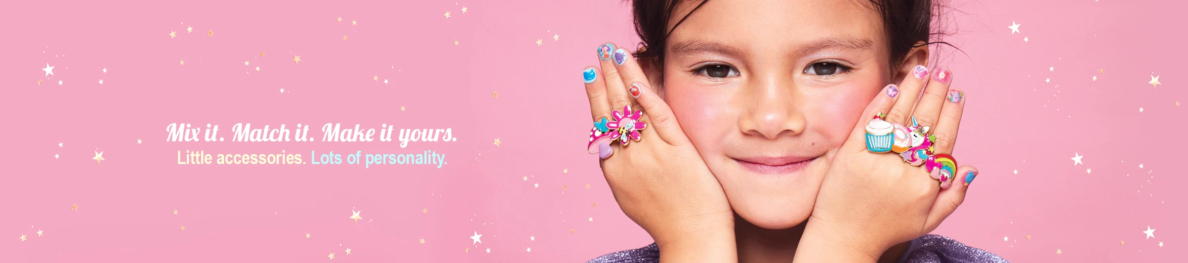 Girl wearing colorful rings and nail stickers from Girl Nation kids accessories collection
