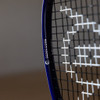 Macro view of the Dunlop FX 115 head edge showing the Sonic Core marking and strings