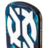Close-up of the Onix Supercell paddle's top corner showing the Power Frame edge guard