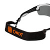 Close-up of the Onix Falcon eyewear strap showing the Onix wordmark on the black elastic band