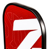 Close-up of the Onix Z5 Mod V2 paddle's grip and red lower face with the Onix logo