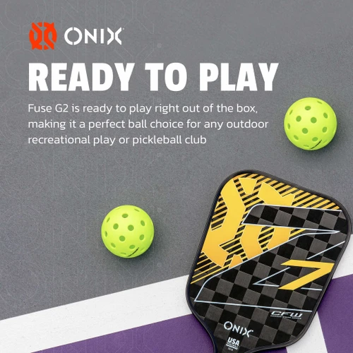Two Onix Fuse G2 Neon-Green pickleballs beside an Onix Z7 paddle on a grey court surface