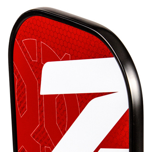 Close-up of the Onix Z5 Mod V2 paddle's grip and red lower face with the Onix logo