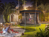 Vuly Thunder Extra Large 14ft Trampoline shown at night