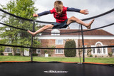 Lifestyle photo of 12ft Telstar Jump Capsule MK3 trampoline outdoors