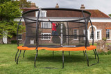 Child bouncing on 14ft Telstar Jump Capsule MK3 in garden