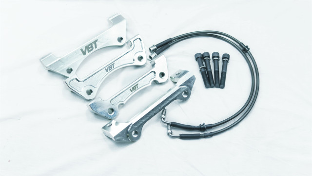 Front Caliper Carrier Kit - Allows Fitment of Aston DB9 4 Piston Brembo Calipers to OE 345mm Discs (AK0010)