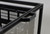 Angled view of wind screen with baskets loaded. Shows corner joint construction and overall frame rigidity under load.