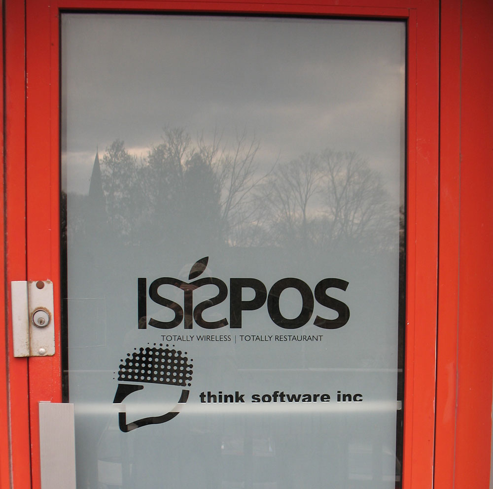 logo cut in frost in orange door frame