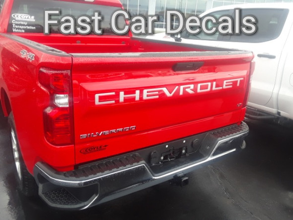 rear of red -20222019 Chevy Silverado Tailgate Stripes CHEVROLET Letters 2019-2024