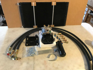 Breakdown photo of parts include AC Compressor with clutch, Compressor mounting hardware, Parallel flow AC Condenser, Receiver drier, Expansion valve, Suction Hose, Discharge hose, Liquid line, Hardware, Instructions included