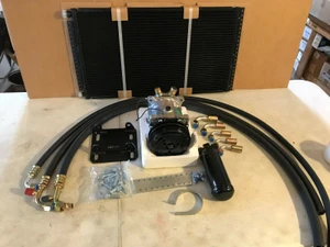 Breakdown photo of parts include AC Compressor with clutch, Compressor mounting hardware, Parallel flow AC Condenser, Receiver drier, Expansion valve, Suction Hose, Discharge hose, Liquid line, Hardware, Instructions included