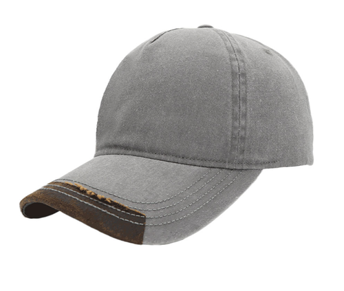 Grey and brown Max Wash 5 Panel Cap from Azulwear, displaying the vintage pigment-dyed grey cotton crown, contrasting brown oilskin peak detail, and adjustable silver buckle back strap ideal for premium outdoor lifestyle wear and game lodge branding in Cape Town, South Africa