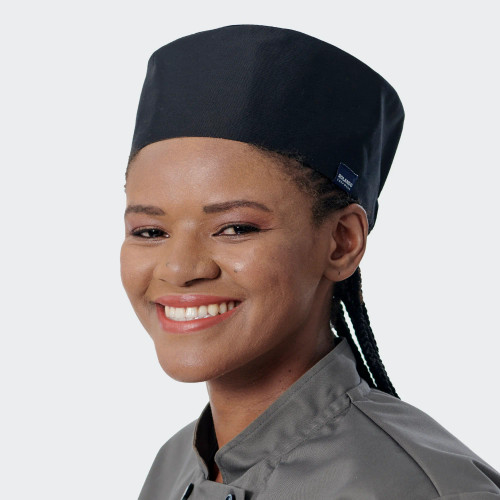 Black poly-cotton beanie cap featuring custom branded restaurant uniform embroidery, Azulwear Pretoria.