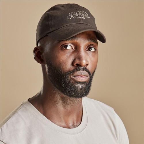 Classic earth-tone Sondela 6 Panel Oilskin Cap by Urban Terrain from Azulwear, displaying the heavy-duty structured layout, curved peak with six rows of reinforced stitching, and water-resistant cotton canvas finish ideal for rugged South African outdoor adventures.