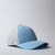 UFlex High Tech Curved Peak Cap | Sky Blue - Side View - Azulwear, South Africa UFlex High Tech Curved Peak Cap | Sky Blue - Side View - Azulwear, South Africa