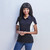 Model wearing the white and black Ladies Championship Golf Shirt, showcasing the contrast panel detailing and a narrow two-button placket, ideal for South African corporate events by Azulwear.