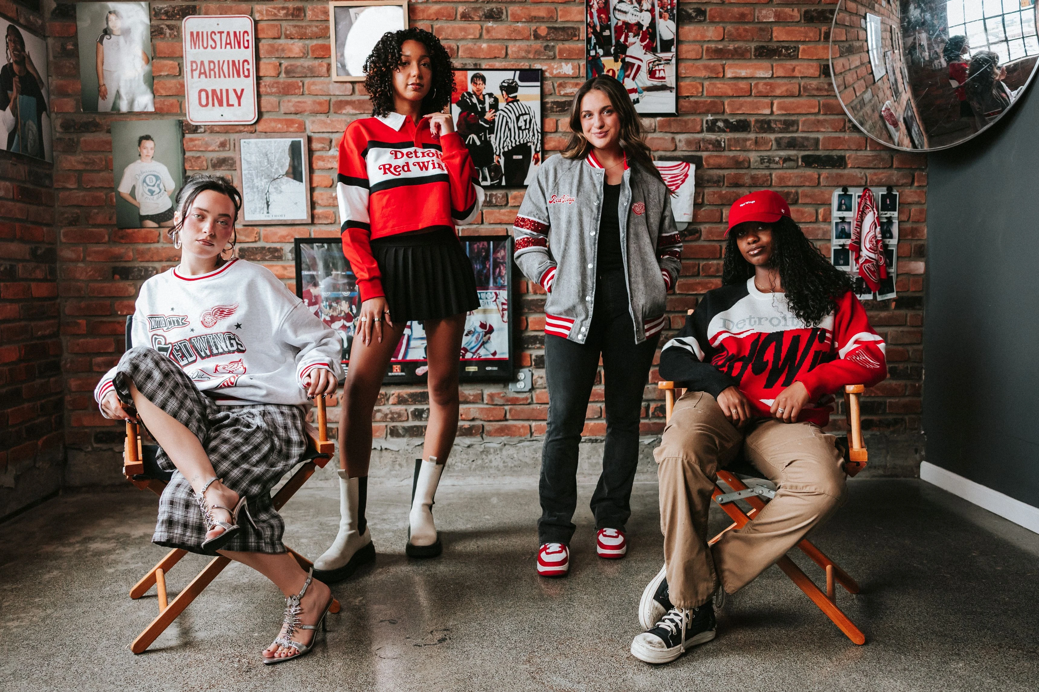 Four females posing and modeling the new Wild Collective apparel for women.  data-size=