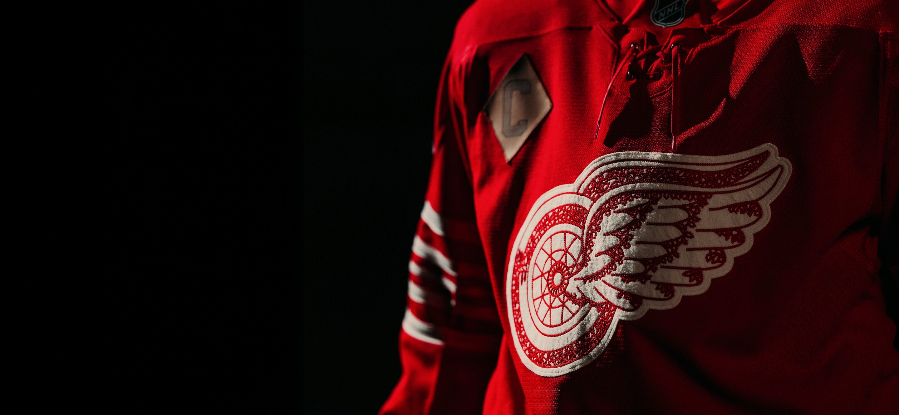 Image showing the new Centennial jersey, available for pre-sale, in a shadowy lighting setting data-size=