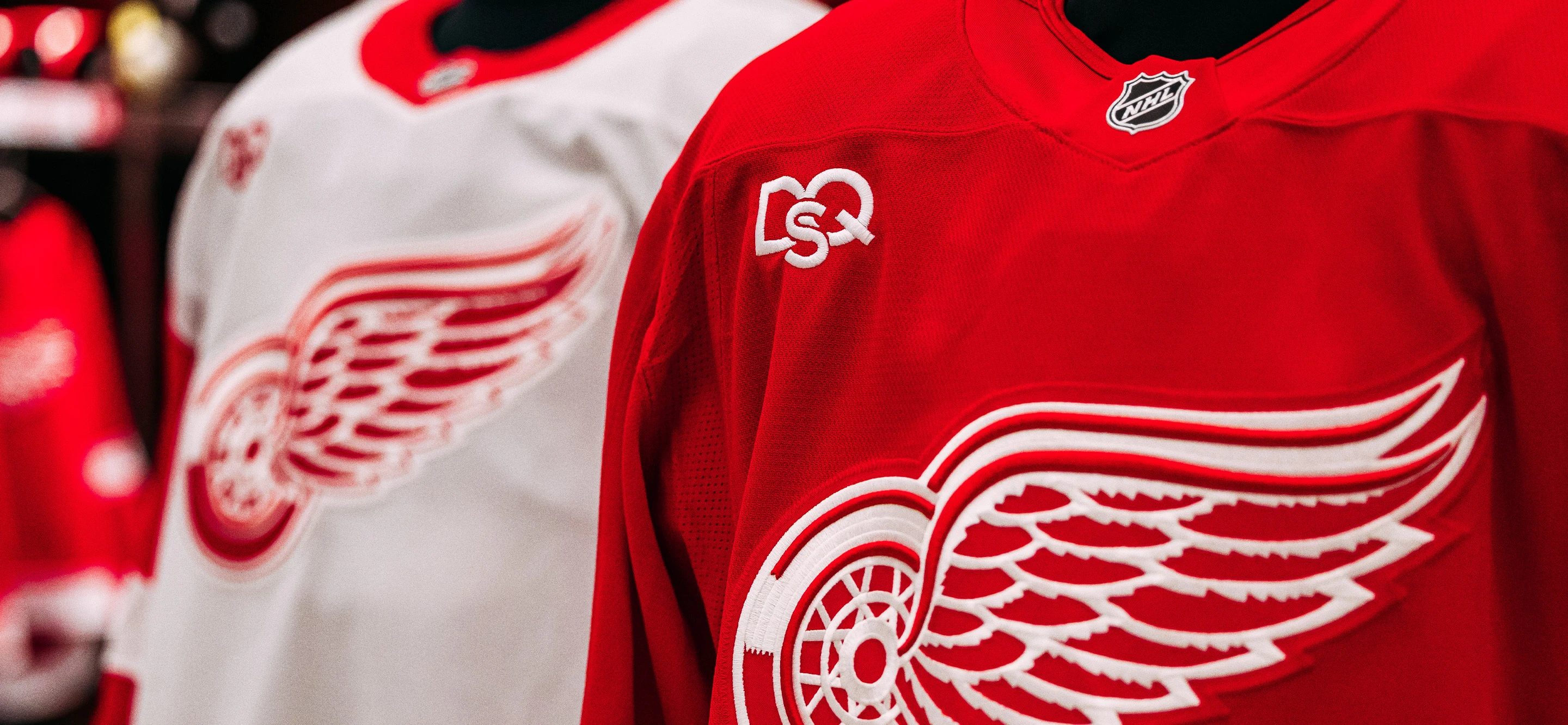 close up image of premium home and away jerseys with new sponsor, DQS,  data-size=