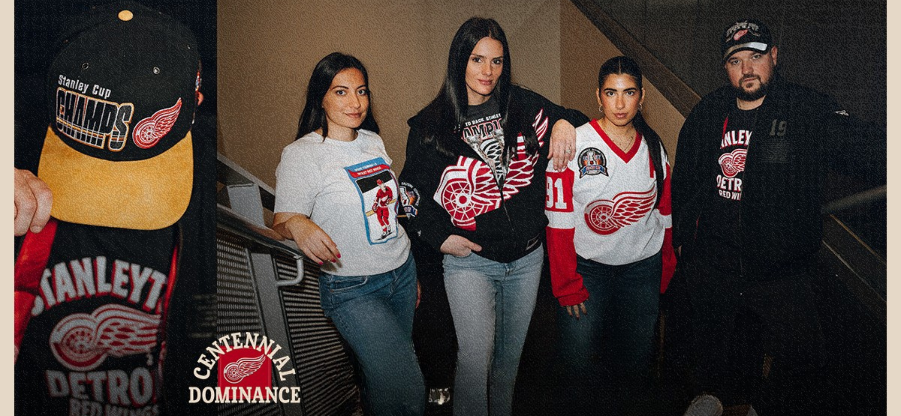 Three females and a male modeling various apparel options included in the Dominance Era collection.  data-size=