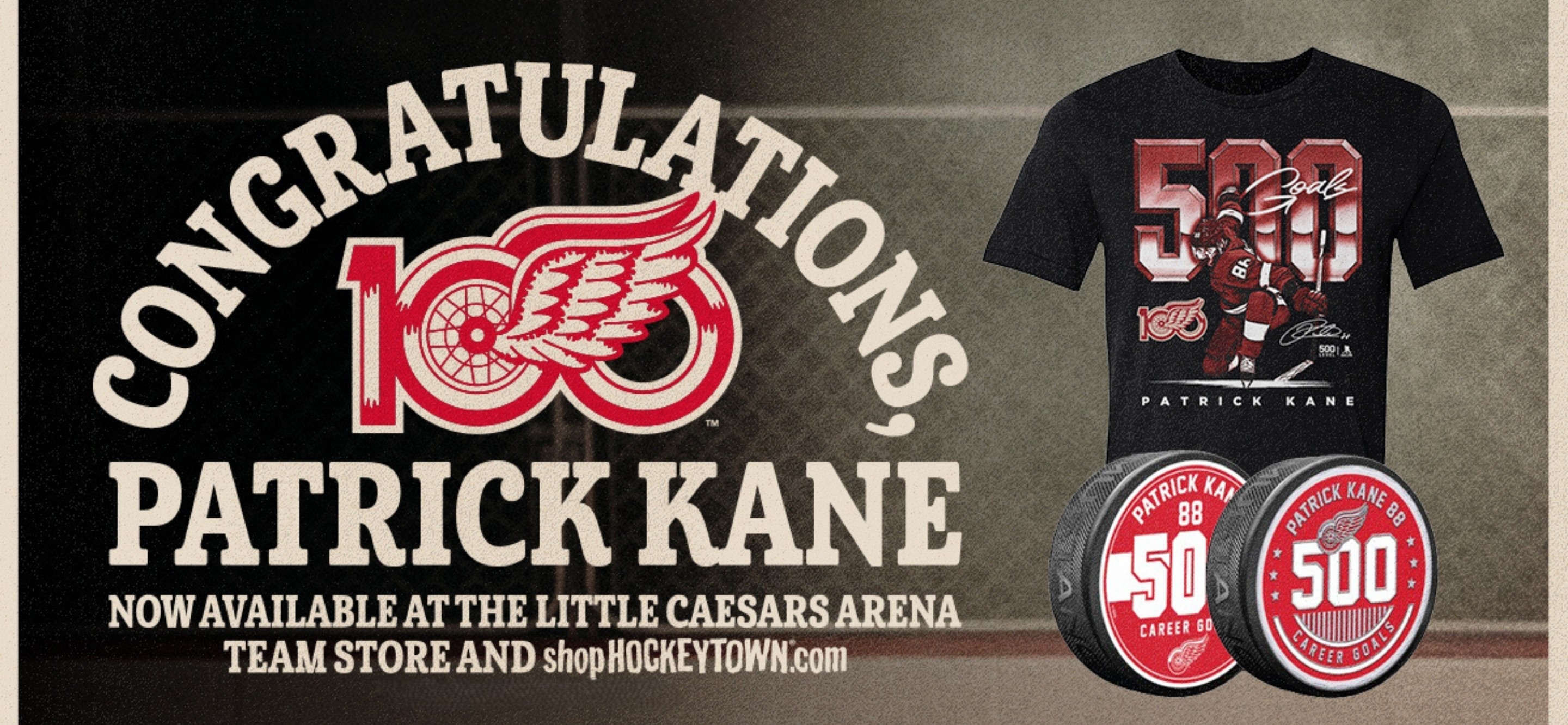Picture showcasing Patrick Kane 500th goal t-shirt and two 500th goal pucks.  data-size=
