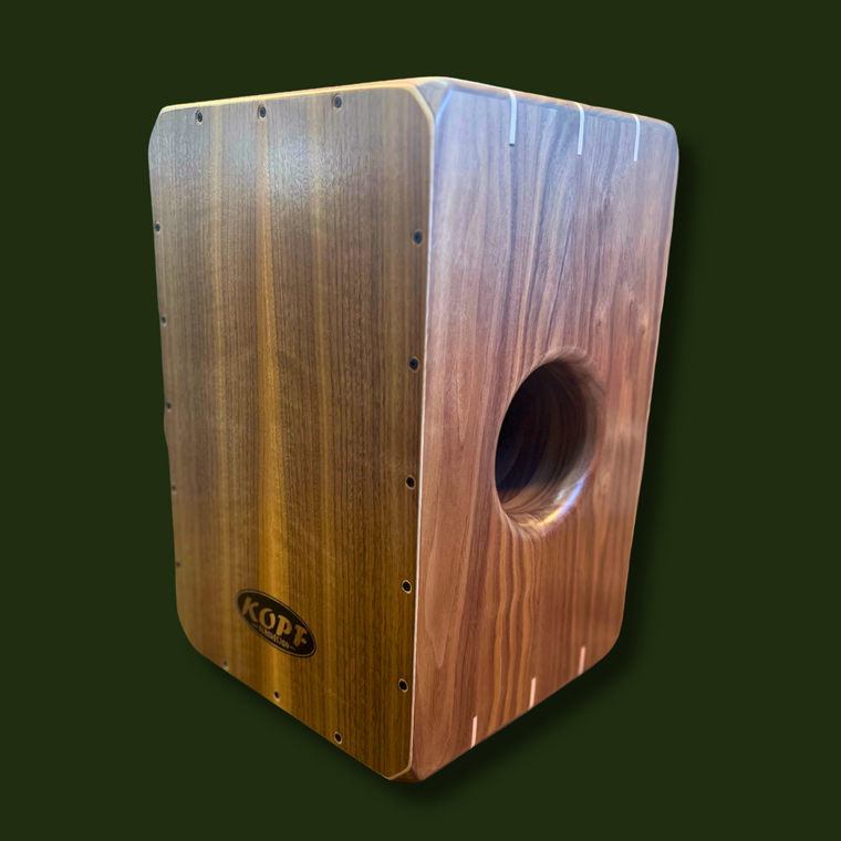 Front view of the Limited Series walnut Cajon with curly walnut faceplate over a hard maple core.