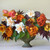 An elegant arrangement of orange and white spring flowers, featuring daffodil Delnashaugh with tulips Lambada, Apricot Impression and Gudoshnik Double.