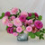 A lush summer flower arrangement featuring several types of dahlias in various shades of pink, including Karma Prospero, Senior's Hope, Diana's Memory, Cantiflora and Stolze Von Berlin.