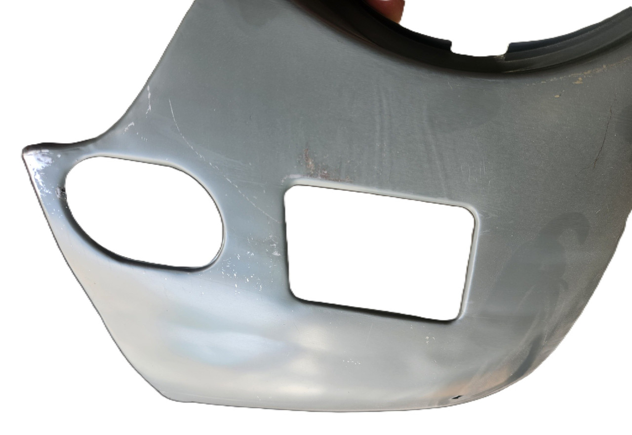 Dented Left Side Front Fender Lower Corner