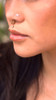 A woman wearing the gold Mayari Nose Stud by Kapwa Kultura. The minimalist stainless steel nose stud features a radiant design inspired by Mayari, the Filipino moon goddess, symbolizing beauty, femininity, and strength. A subtle yet striking piece that highlights Filipino heritage and modern elegance.
