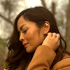 A woman wearing the gold Mayari Ear Cuff by Kapwa Kultura on her left ear. The stainless steel ear cuff showcases a crescent-inspired design inspired by Mayari, the Filipino moon goddess, symbolizing grace, empowerment, and Filipino heritage. A modern, no-piercing accessory that adds subtle elegance and cultural meaning.