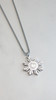 Close-up of the steel Diwa Tribal Necklace by Kapwa Kultura, highlighting its polished stainless steel Filipino sun pendant with detailed tribal engravings and an adjustable chain.
