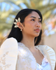 A young Filipina woman wears the Gold Reyna Ear Cuff paired with a beautiful Filipiniana dress, gazing away from the camera for a soft, graceful, and regal look. This gold ear cuff brings a bold yet elegant statement to any Filipino-inspired outfit, making it the perfect accessory for cultural events, weddings, formal occasions, and modern Filipiniana fashion. A stunning piece that celebrates Filipina beauty, heritage, and confidence.
