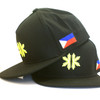 Two Kapwa Kultura Legacy Snapback hats stacked, bottom hat showing front logo and top hat showing Philippine flag, Filipino pride streetwear caps