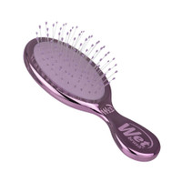 WetBrush Festive Finish Mini Detangler Purple with shimmering metallic finish and flexible IntelliFlex bristles, a compact travel-friendly brush for gentle detangling on-the-go.