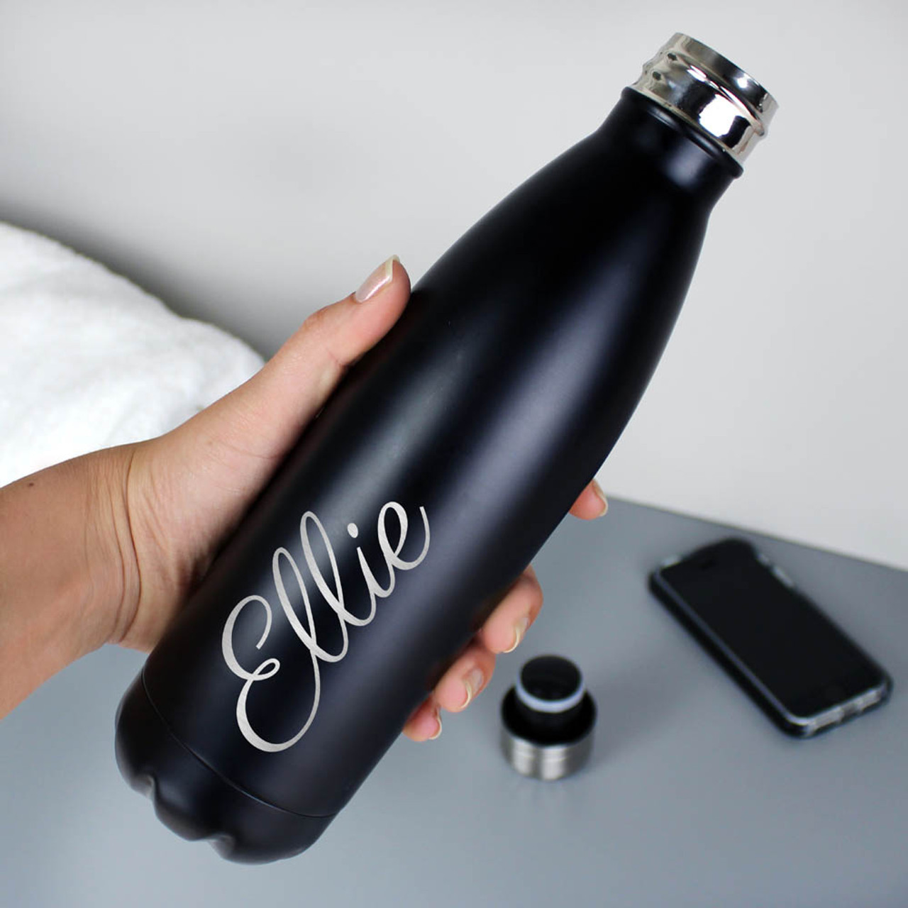 insulated drinks bottle in hand